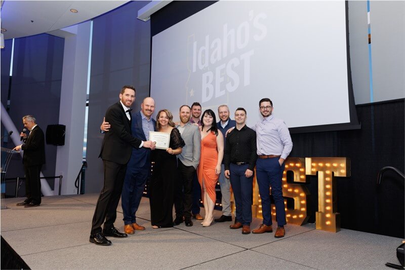 Idaho Roofing Contractors team receiving an award on stage at Idaho's Best ceremony.