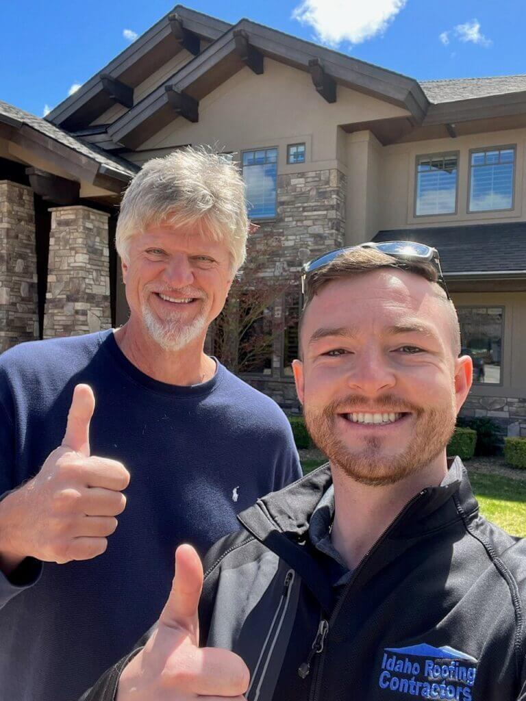 Two men standing in front of the Vizcaya Subdivision home