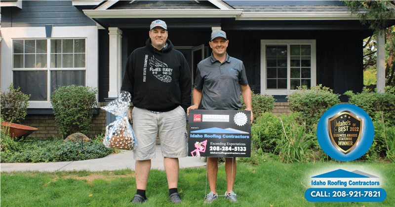 Idaho Roofing Contractors standing in front of a completed roof project in Boise, Idaho
