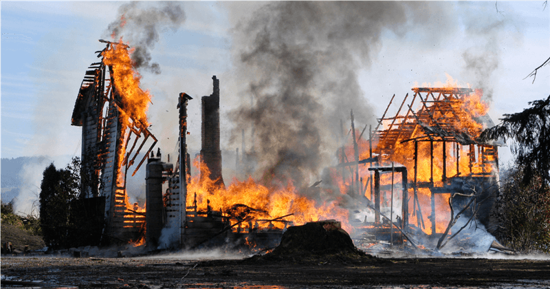 a home engulfed in flames